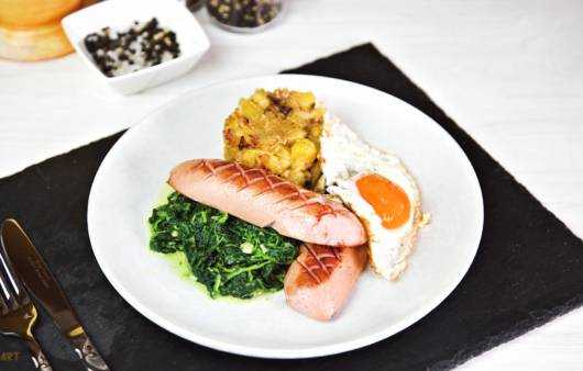Spinat mit gebratener Knacker Rezept